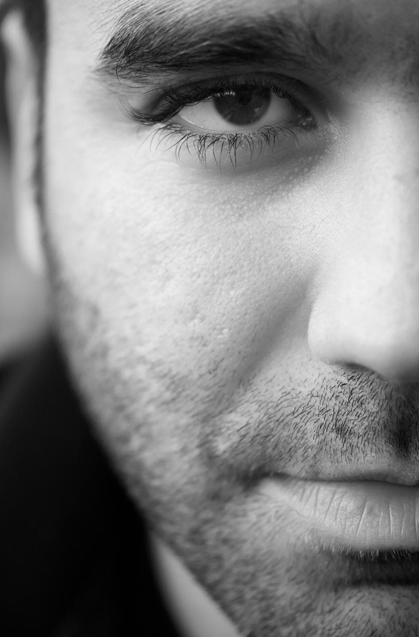 Close-up male face, B&W, precision rhinoplasty planning
